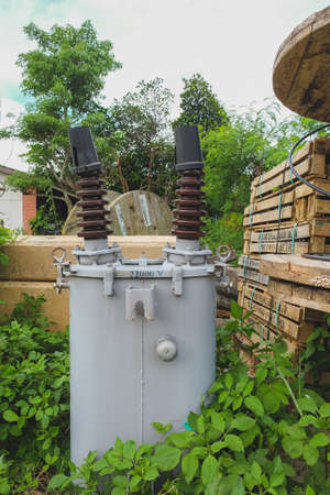 Many insulators in wooden boxes,stock of installation of electrical welding.