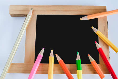 Small blank chockboard and color pencil with copy space.