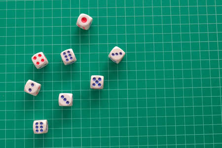 Top view rolling dice on green cutting mat background.の写真素材