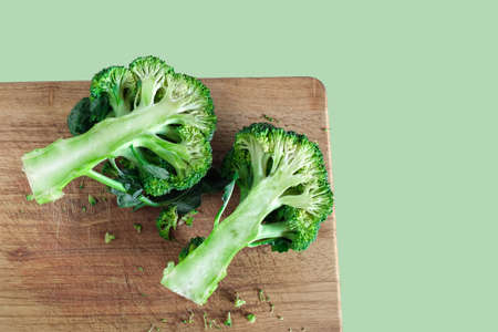 Fresh green broccoli on color background. Organic food.の写真素材