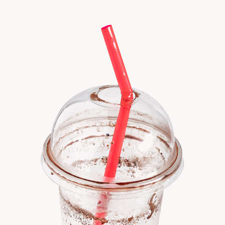 Empty plastic cup for cocktail and straw.の写真素材