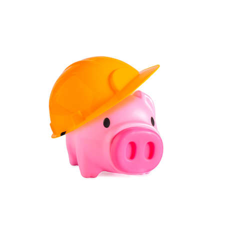 Piggy bank with yellow construction on background.の写真素材