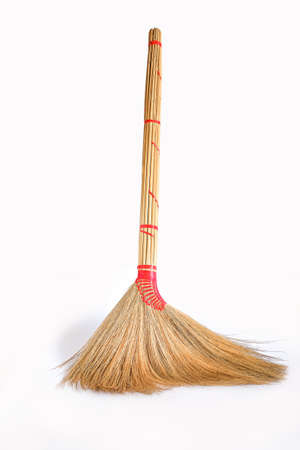 Big yellow broom sweep floor with long wooden handle.の写真素材