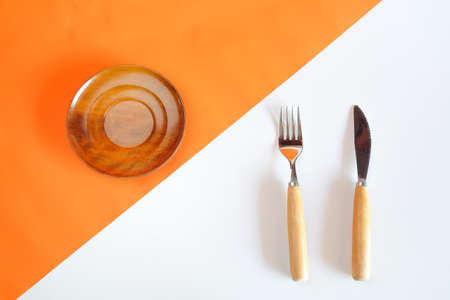 kitchenware on Orange color of paper and white board.の写真素材