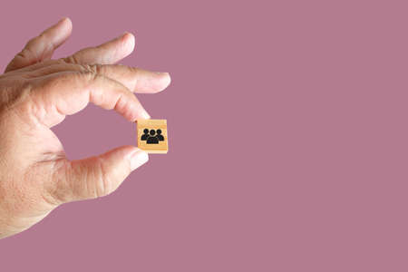 Hand hold a wooden cubes toy with icon .の写真素材