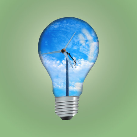 Wind Turbine in light bulb concept green environment.