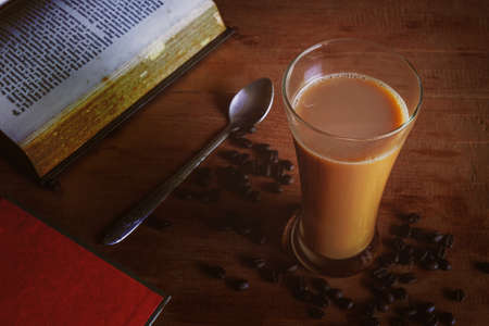 Coffee latte in tall glass, rustic style and refreshment.