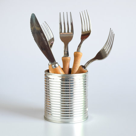 Kitchenware in old can on background.の写真素材
