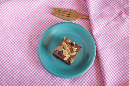 Fresh brownies in small dish on table. Delicious chocolate pie.の写真素材