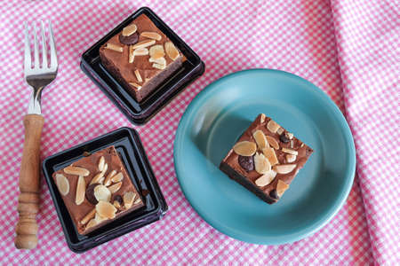 Fresh brownies in small dish on table. Delicious chocolate pie.