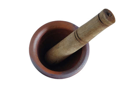 Clay mortar and wood pestle is a kitchenware object on white.の写真素材