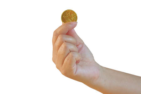 Golden coins money  in hand on background.