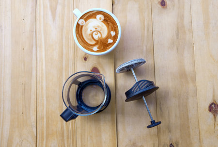 Coffee maker french press on wood table.の写真素材