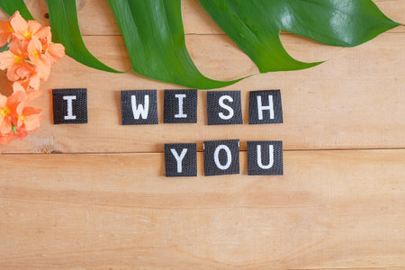 I Wish You text on tag over wood table.