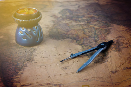 compass or dividers  on old world map. Travel, geography.