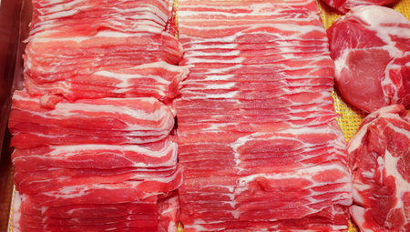 Raw Thin Sliced pork on trayの写真素材