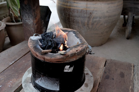 Started a fire burning on Charcoal stove for cooking.の写真素材