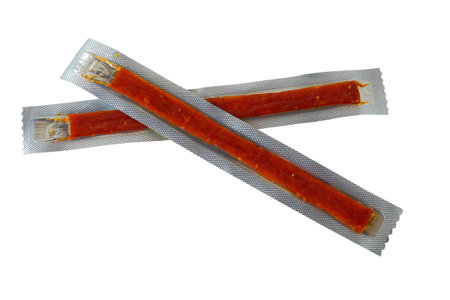 Dried beef meat sliced on white background.