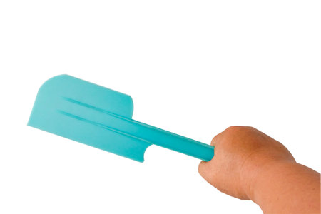 Blue plastic spatula for baking on white backgroundの写真素材