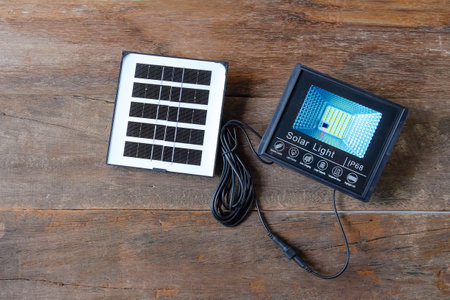 Solar lighting and solar panel on wood table ,Ecological electrical energy .の写真素材