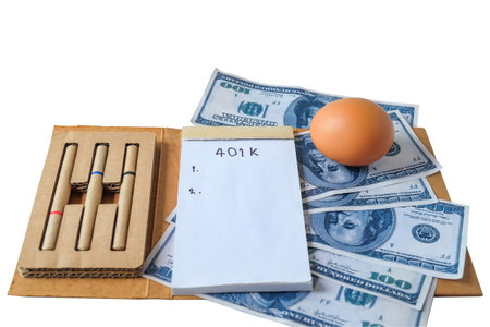 401k  Plan note with egg and Pile of US Money.の写真素材