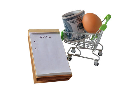 401k  Plan note with egg and Pile of US Money.の写真素材