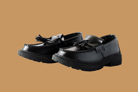 A party wear leather formal men shoes on color background.の写真素材