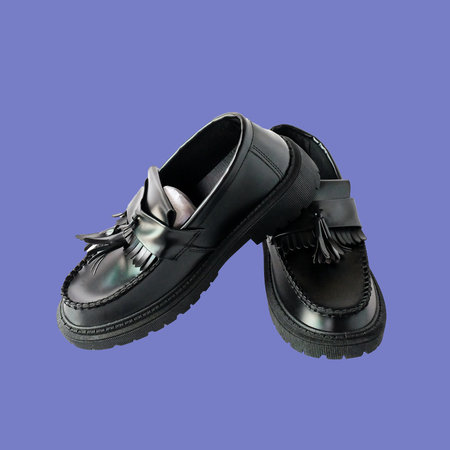 A party wear leather formal men shoes on color background.の写真素材