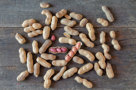 Ground peanuts on wood background ,ingredient food.