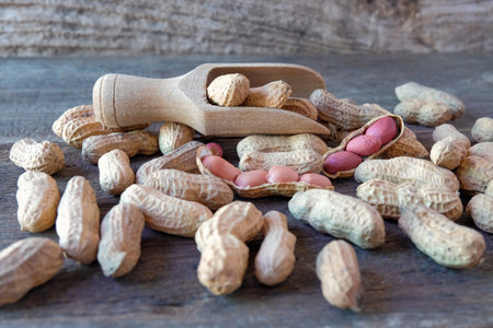 Ground peanuts on wood background ,ingredient food.