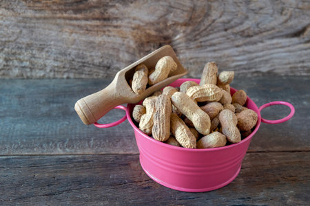 Ground peanuts in the bowl ,ingredient food.