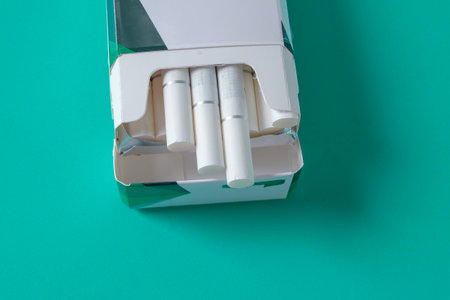 Open pack of menthol cigarettes on background.の写真素材