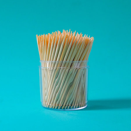 Group of toothpicks made of bamboo in a cup on background.の写真素材