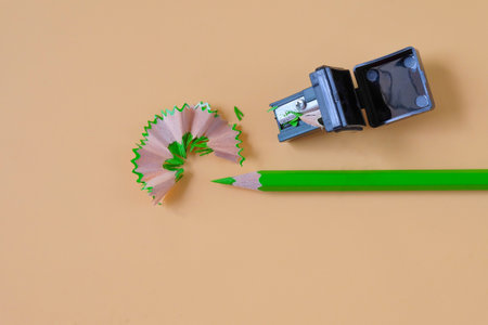 Green pencil tip shavings from sharpener on background .の写真素材