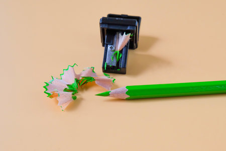 Green pencil tip shavings from sharpener on background .の写真素材