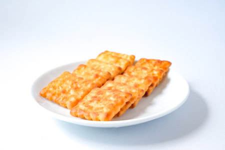 Square biscuits over a white background.の写真素材