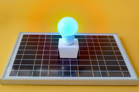 Composition with solar panel, led lamp, on texture background.の写真素材