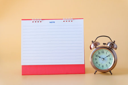 Alarm clock with blank note calender.back to school concepts.の写真素材