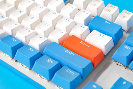 Computer keyboard on blue background. Top viewの写真素材