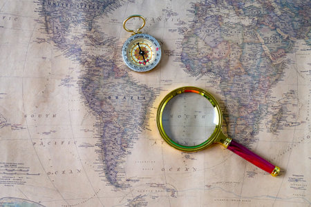 A magnifying glass on old map background.