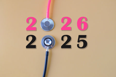 Pink stethoscope and numbers 2026 and black stethoscope and numbers 2025.