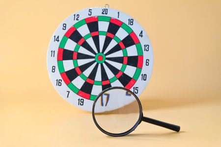 Dart board game with magnifying, Leader concept.
