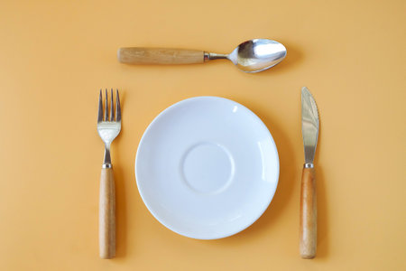 Spoon, Fork and knife with white Empty plate.の写真素材