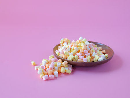 Colorful sweet candy in wood dish on background.の写真素材