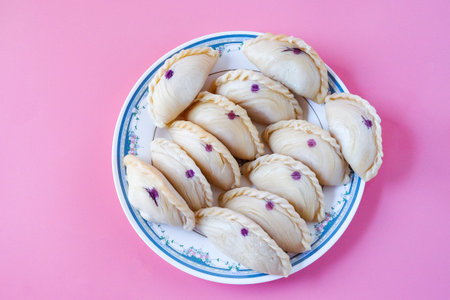 Curry puff snack made from puff pastry skin and filled with curry chicken.の写真素材