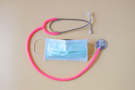 Stethoscope with face mask with color background.