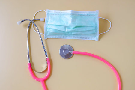 Stethoscope with face mask with color background.