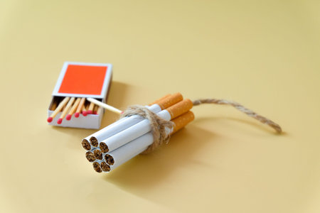 A cigarettes binding with a cord looks like a dynamite.の写真素材