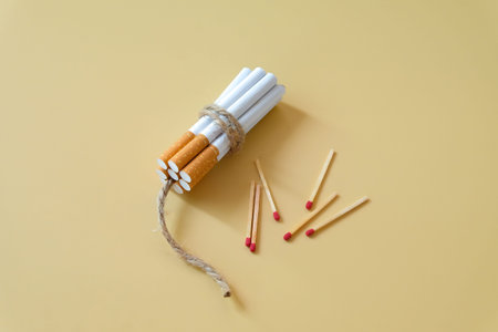 A cigarettes binding with a cord looks like a dynamite.の写真素材