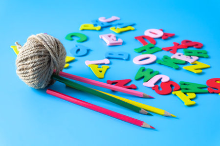 Minimalist photo of a natural jute twine with alphabet letters.の写真素材